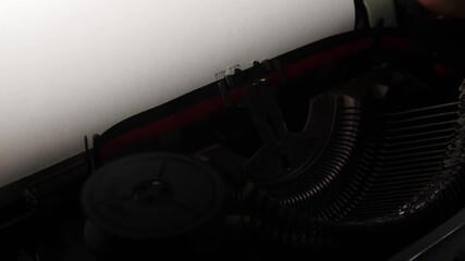 Vintage typewriter showing the end typed onto a sheet of white paper, symbolizing conclusion, finality, and the culmination of a creative writing process or story