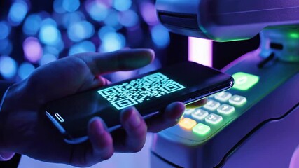 A person's hand holds a smartphone with a QR code on its screen, illuminated by a red laser beam from a scanning device - Powered by Adobe