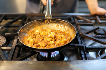 chef preparing gnocchi by hand in the traditional way