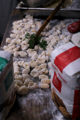 chef preparing gnocchi by hand in the traditional way