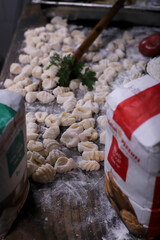 chef preparing gnocchi by hand in the traditional way