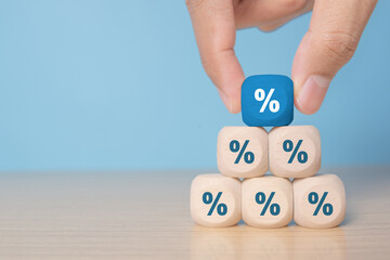 Wooden blocks with percentage sign, interest rate decline, investment reduce or Sales discount concept, copy space