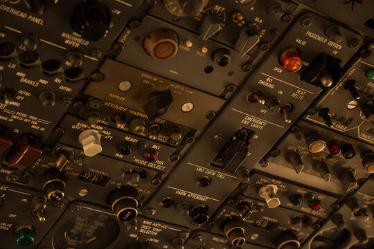 Close-up View of an Intricate Airplane Cockpit Control Panel.
