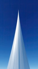 Modern Conical Skyscraper Against Blue Sky