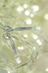 A tangled string of Christmas lights. Christmas and New Year lights. Festive atmospheric background 