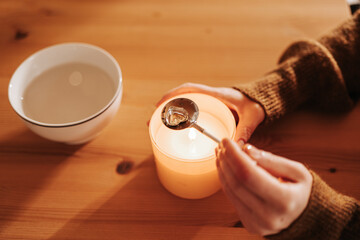 Fun tin casting set for New Years party.molten tin in a bowl of water. Fortune telling with melting tin.Fun tin casting set for New Years party.