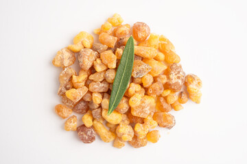 Frankincense or olibanum aromatic resin isolated on white background used in incense and perfumes.