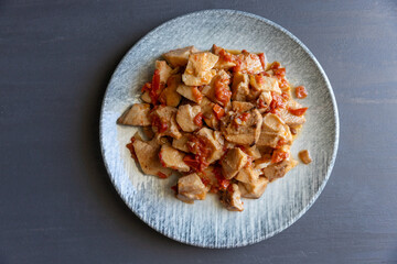Stewed taro roots kolokasi with potato and tomatoes. North Cuprus traditional dish, top view close up