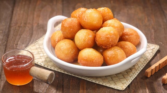 Loukoumades, luqaimat or lokmais eastern cuisine donunts popular during Ramazan