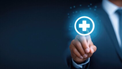Businessman hand holding glowing medical cross icon representing digital healthcare technology innovation. Doctor or executive touching futuristic health symbol.