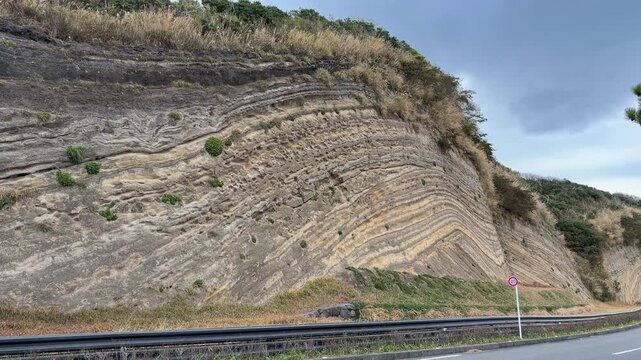 Folded Strata Road Cut and Rock Outcrop on Izu Oshima Island, Japan
