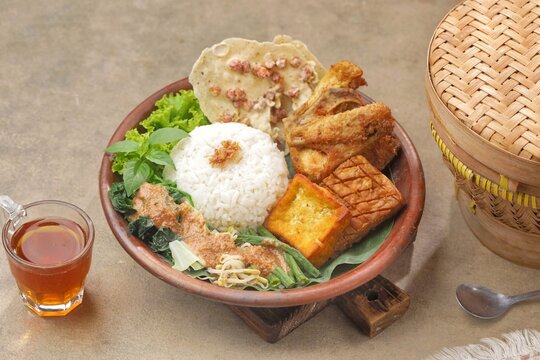 Nasi pecel or sega pecel is a typical Javanese Indonesian rice dish served with pecel.