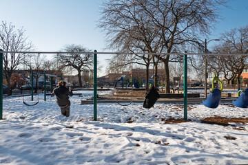 Couple on swing in winter
