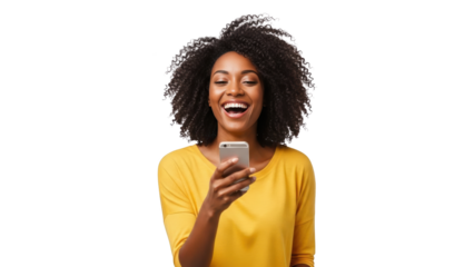A young woman with curly hair excitedly views her smartphone in a studio setting with a bright background.