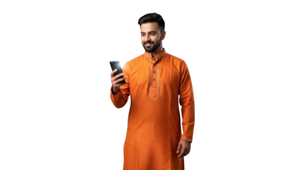 A man in traditional attire using a smartphone with a bright screen and smiling.