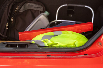 Car trunk packed with travel safety equipment. Concept of secure journey © Vero Dibe