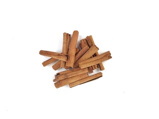 Pile of cinnamon sticks isolated on white background. Top view 