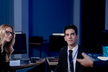 At a global innovation summit diverse thought leaders discuss the future of sustainable technology with one male delegate posing a key question about AI ethics and digital transformation.