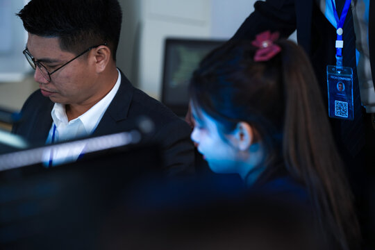 Code review success moment. Smiling female developers react positively colleague points out elegant solution code screen late night agile sprint win team synergy achieves goals faster. - Powered by Adobe