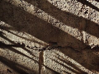 Light and shadow on the wall surface.