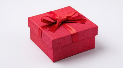 Obraz premium Elegant Red Gift Box with Bow for Special Occasions and Celebrations