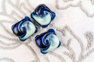 Laundry detergent pods on soft towel