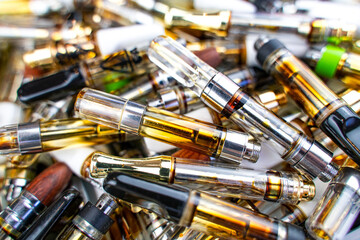 Vape cartridge waste background. Environmental pollution concept. 