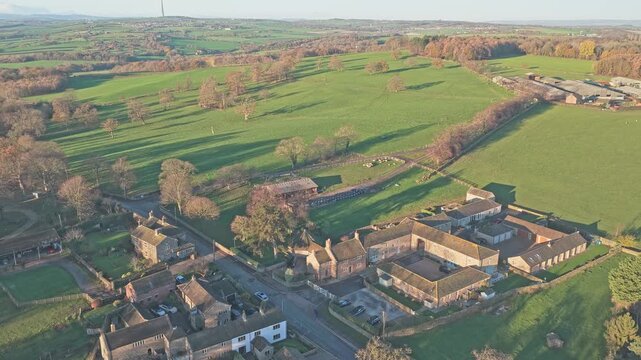 Drone stablishing shot of the historic Bretton Hall within its parkland setting, highlights cultural transformation of the former manor house and college grounds into the Yorkshire Sculpture Park