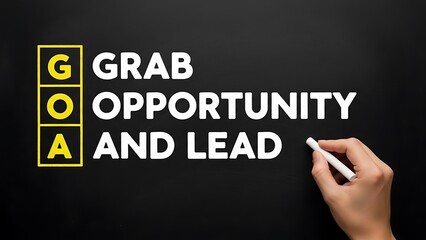 Hand writing goa acronym grab opportunity and lead motivational message on dark chalkboard background