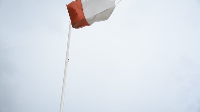 Indonesian flag. weathered flag in the wind