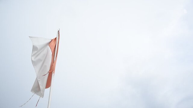 Indonesian flag. weathered flag in the wind