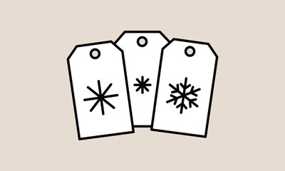 white tags with black snowflakes on beige background
