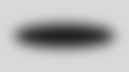 Blurry black oval shape on gray background