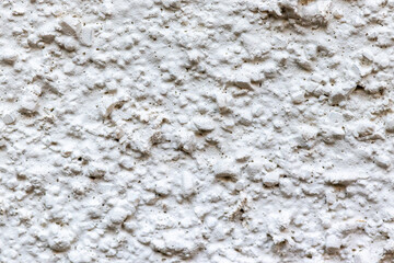 ざらざらした質感の白い壁