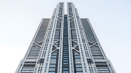 Fototapeta premium Majestic Modern Skyscraper Reaching High Low angle skyscraper symmetry showcasing architectural design