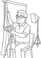 Coloring book Dad setting up background and tripod in studio