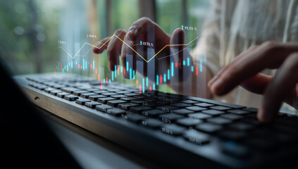 Close-up of hands typing on a keyboard with a digital financial chart overlay, illustrating the dynamic world of finance, data analysis, and market trends. Scalp