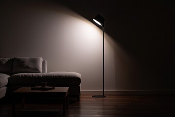 Cozy living room scene with a sofa and floor lamp casting a warm glow