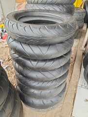 Pile of Used Motorcycle Tires at the Workshop