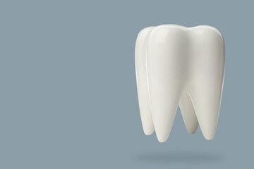 Tooth model on blue background for dental education