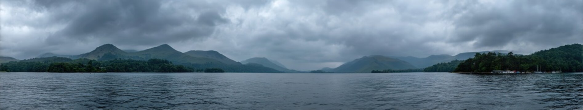 Lake view with mountains under overcast sky tranquil natural outdoor panoramic landscape
