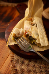 Tamales. Traditional dish typical of Mexico and some Latin American countries. Corn dough wrapped in corn leaves. The tamales are steamed.