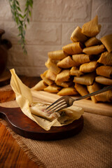 Tamales. Traditional dish typical of Mexico and some Latin American countries. Corn dough wrapped in corn leaves. The tamales are steamed.