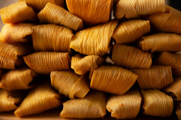 Tamales. Traditional dish typical of Mexico and some Latin American countries. Corn dough wrapped in corn leaves. The tamales are steamed.