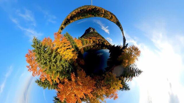Tiny Planet Effect of Autumn Forest with Blue Sky and Clouds.