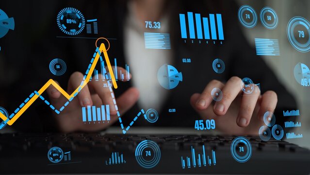 A business professional engages with digital data on a laptop, analyzing various graphs and statistics in a modern office environment to gain financial insights. Xenic