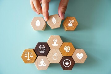 Hand holding a set of dice representing a business success concept for achievement and goal setting with web design icons and puzzle solution symbols