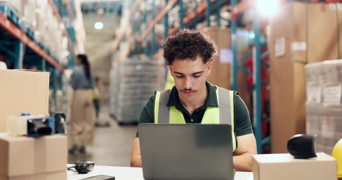 Laptop, thinking and typing with man in logistics warehouse for distribution or shipping update. Computer, problem solving and supply chain with person in storage depot for agenda or schedule