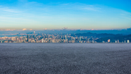 Empty asphalt road and city skyline with modern buildings at sunrise in Shenzhen