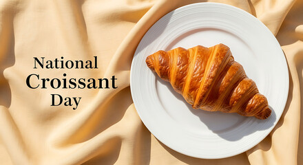 Golden brown croissant served on a white plate for national day